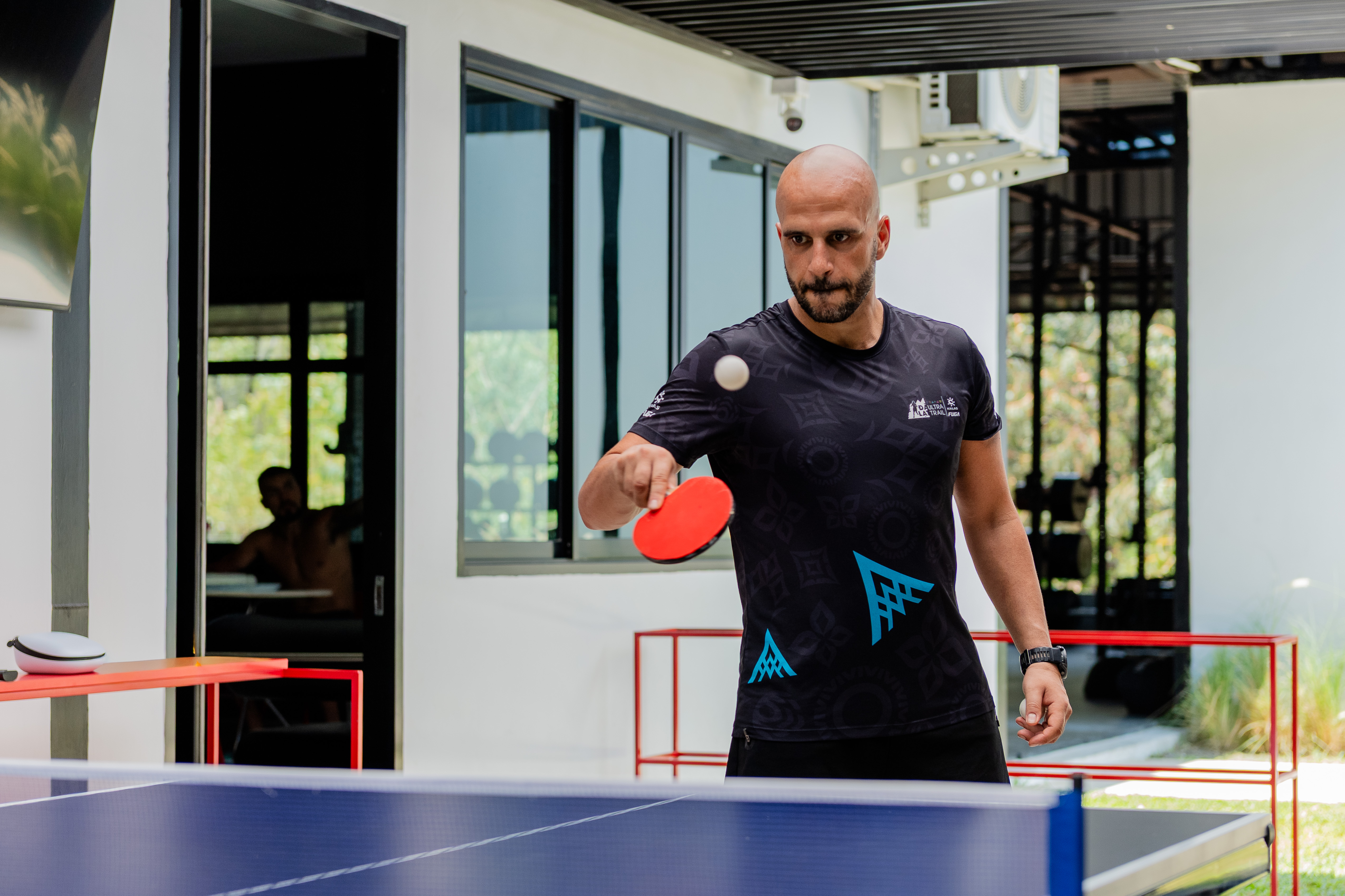 Guests playing table tennis between sessions