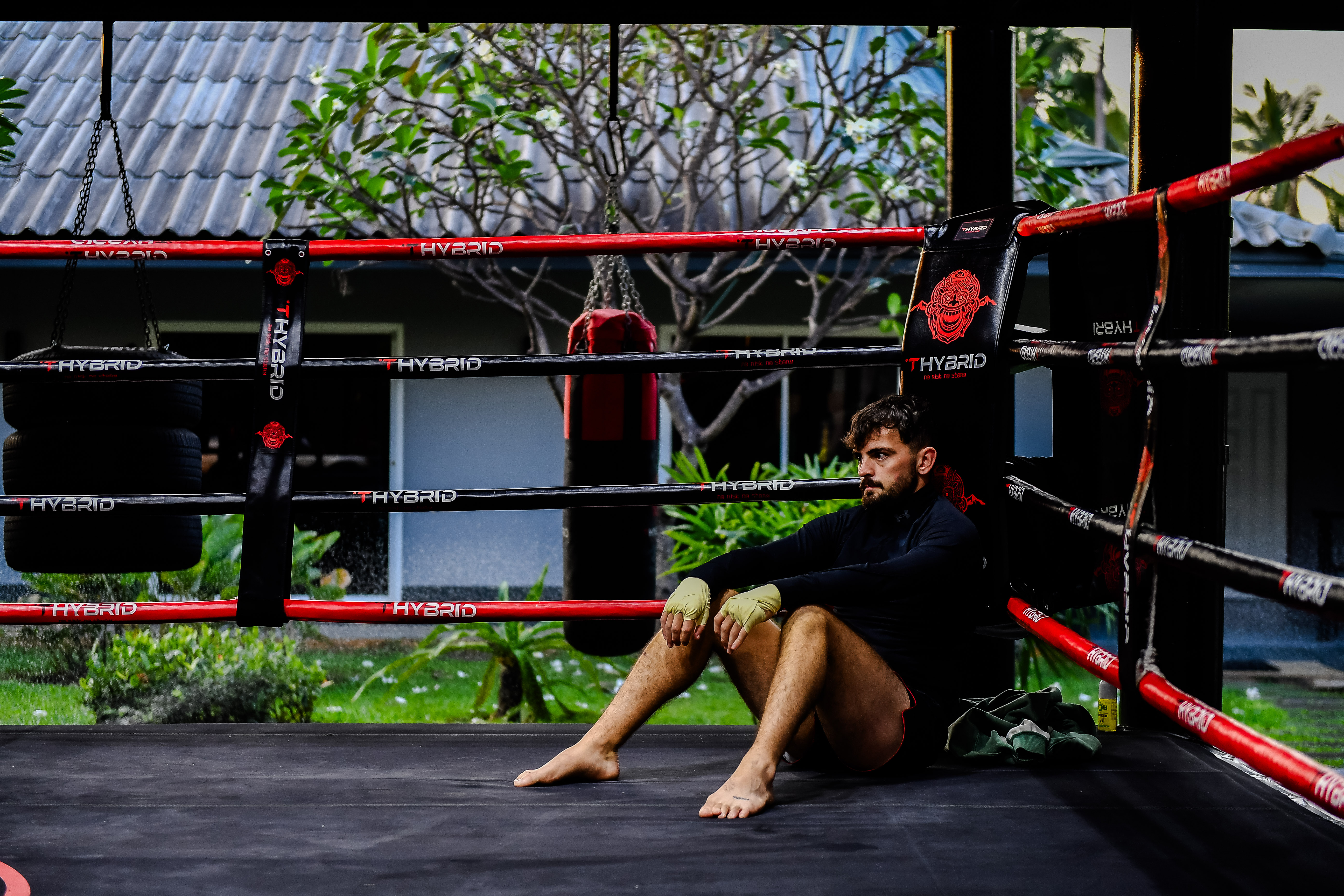 Guest resting on the mats after a combat and boxing session