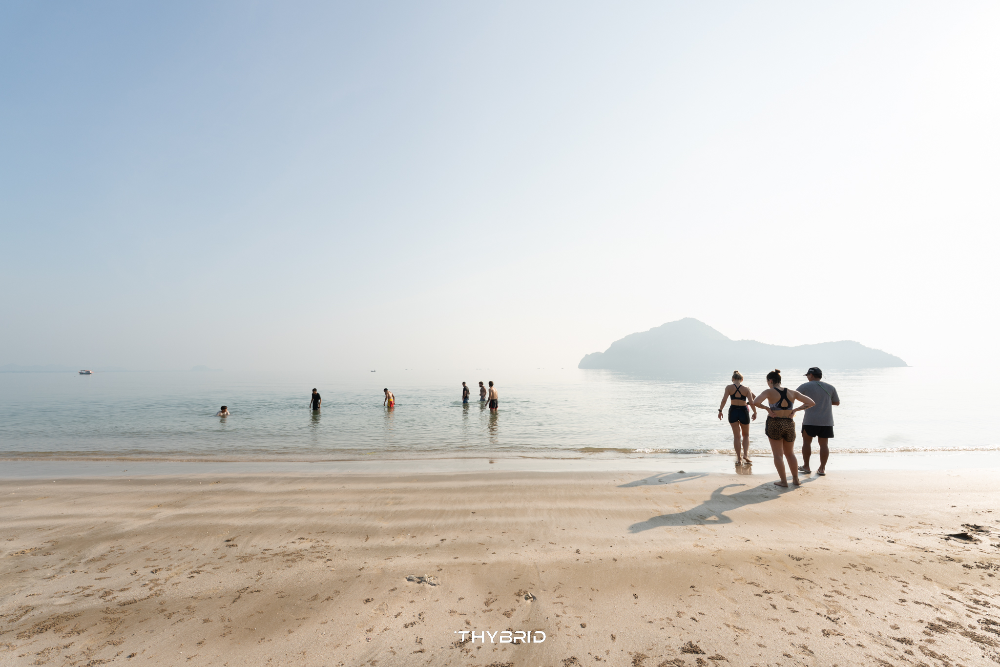 Guests running along Sam Roi Yot beach